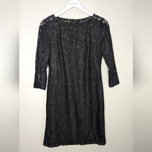 Beautiful classic lace black short dress with 3/4th sleeves. Trina Turk. Size 2